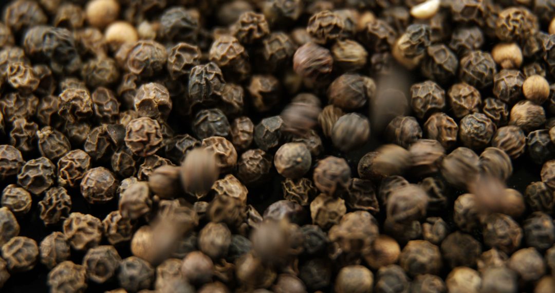 Close-up of black peppercorns, showcasing their texture and detail - Free Images, Stock Photos and Pictures on Pikwizard.com