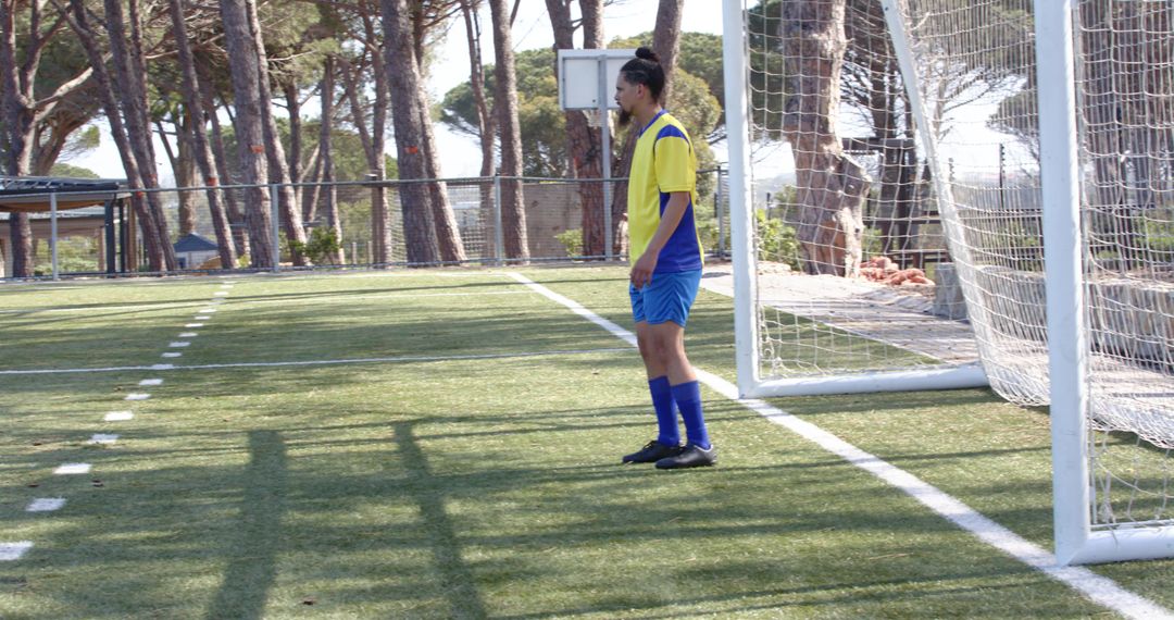 Soccer Player Concentrating in Front of Goal