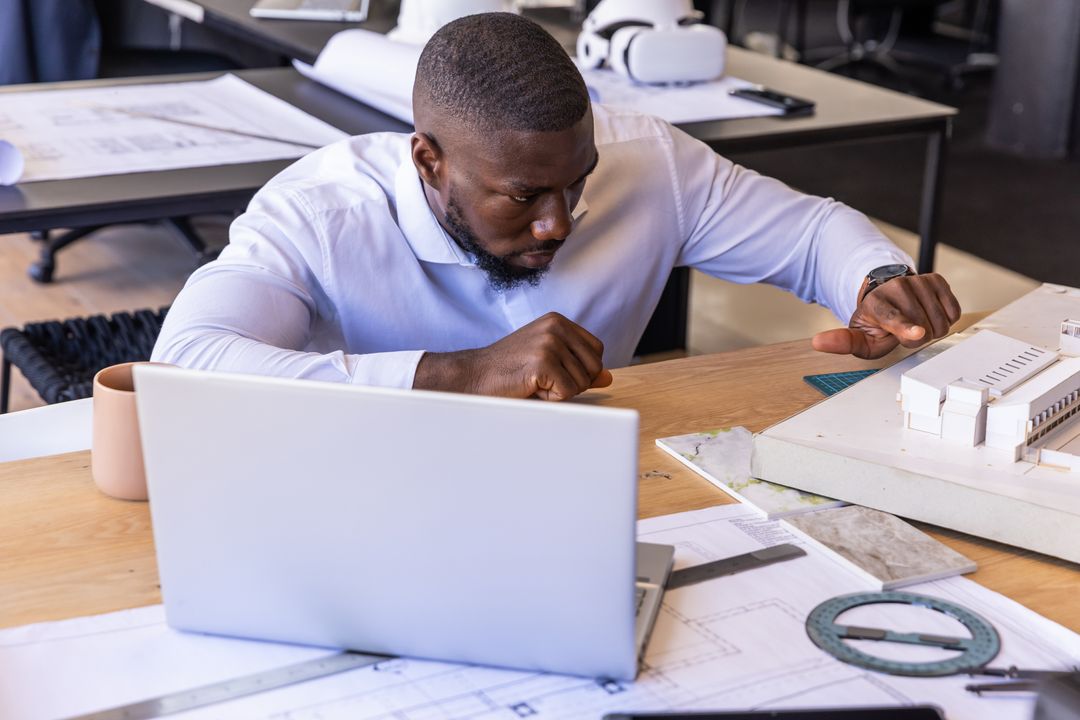 Architect Focus Adjusting Scale Model at Design Studio