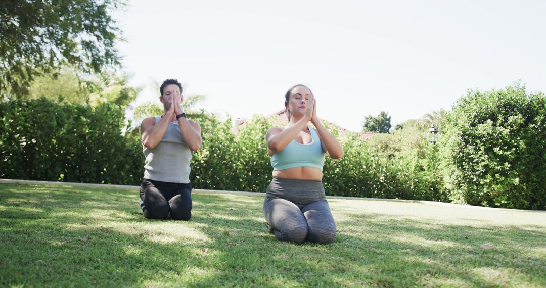 Couple Practicing Yoga in Sunny Garden for Outdoor Wellness - Free Images, Stock Photos and Pictures on Pikwizard.com