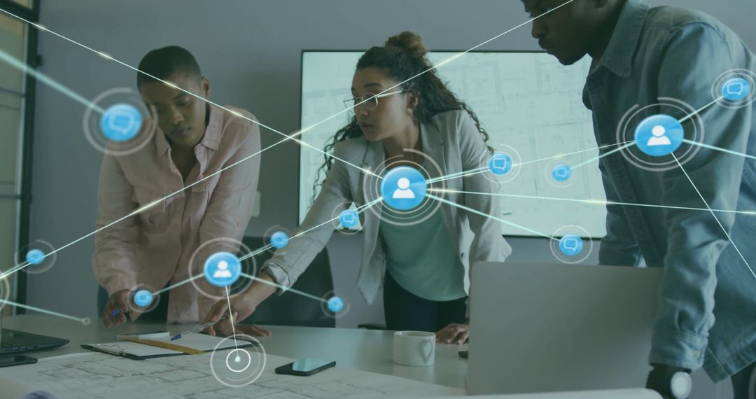 Colleagues Collaborating on Digital Network Strategy in Modern Office