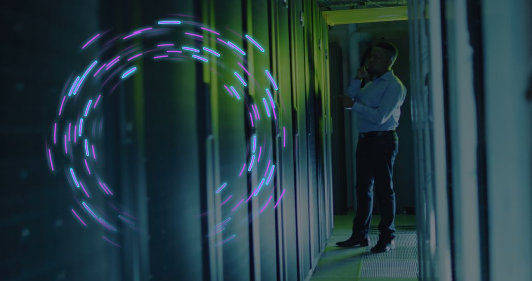 Engineer Working Inside High-Tech Data Center with Digital Interface Overlay - Free Images, Stock Photos and Pictures on Pikwizard.com