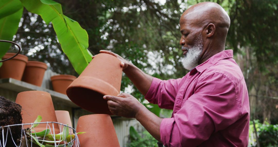 Senior Man Gardening with Terracotta Pots in Outdoor Garden - Free Images, Stock Photos and Pictures on Pikwizard.com