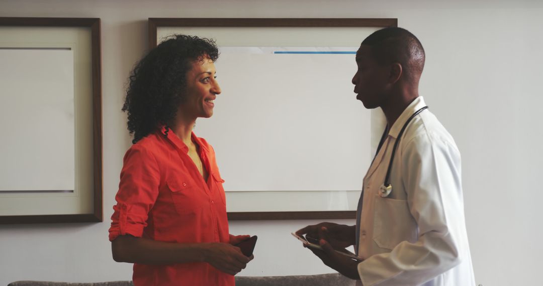 Doctor Discussing Diagnosis with Female Patient in Medical Office - Free Images, Stock Photos and Pictures on Pikwizard.com