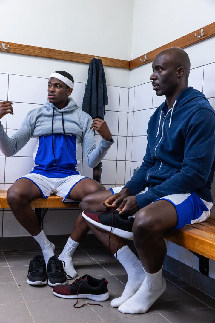 Athletes Preparing for Training Session in Locker Room