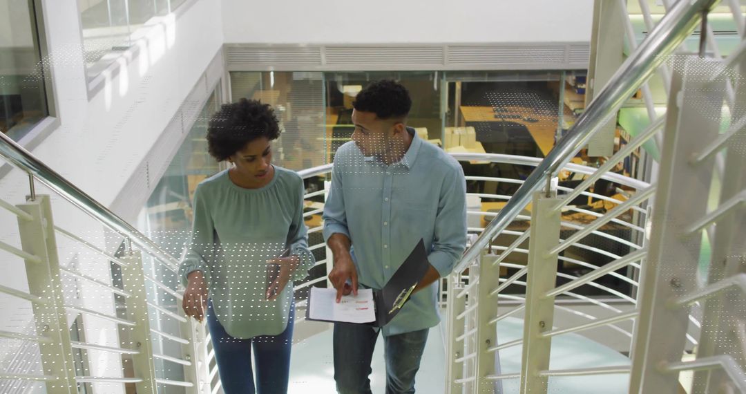 Diverse Business Colleagues Discussing Strategies on Office Staircase