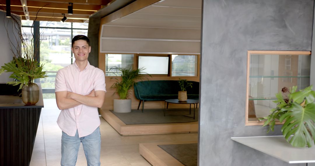 Confident Professional Standing in Stylish Modern Office Lobby