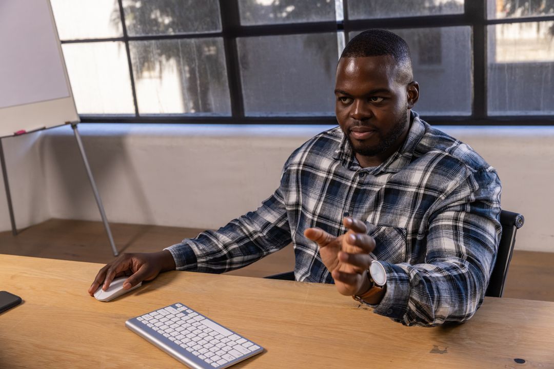 Focused Professional Man Using Technology in Modern Office