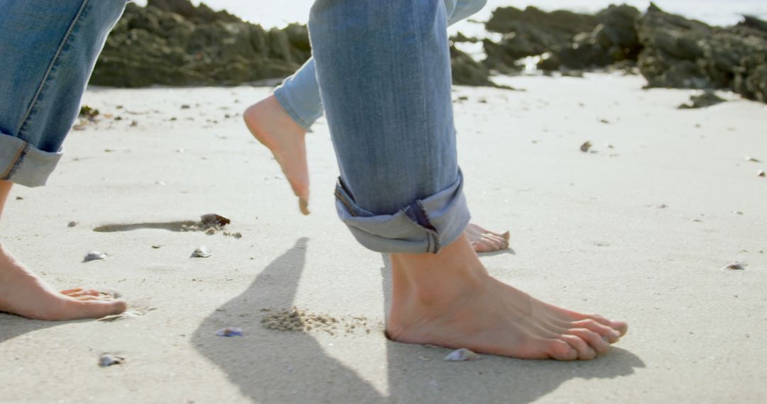 Close-up of Bare Feet Walking on Sandy Beach - Free Images, Stock Photos and Pictures on Pikwizard.com