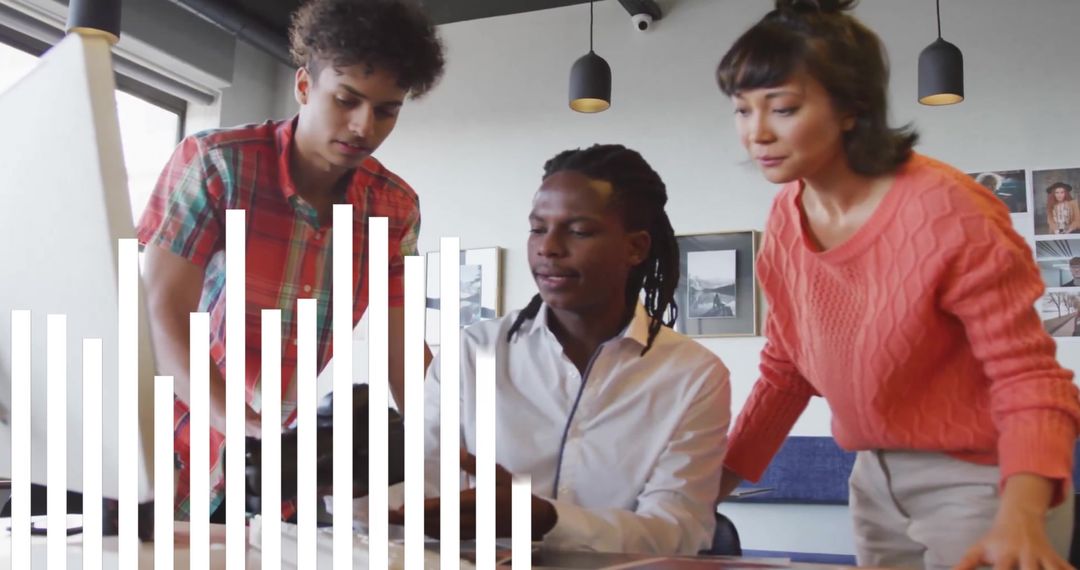 Diverse Colleagues Collaborating Over Data Insights in Office