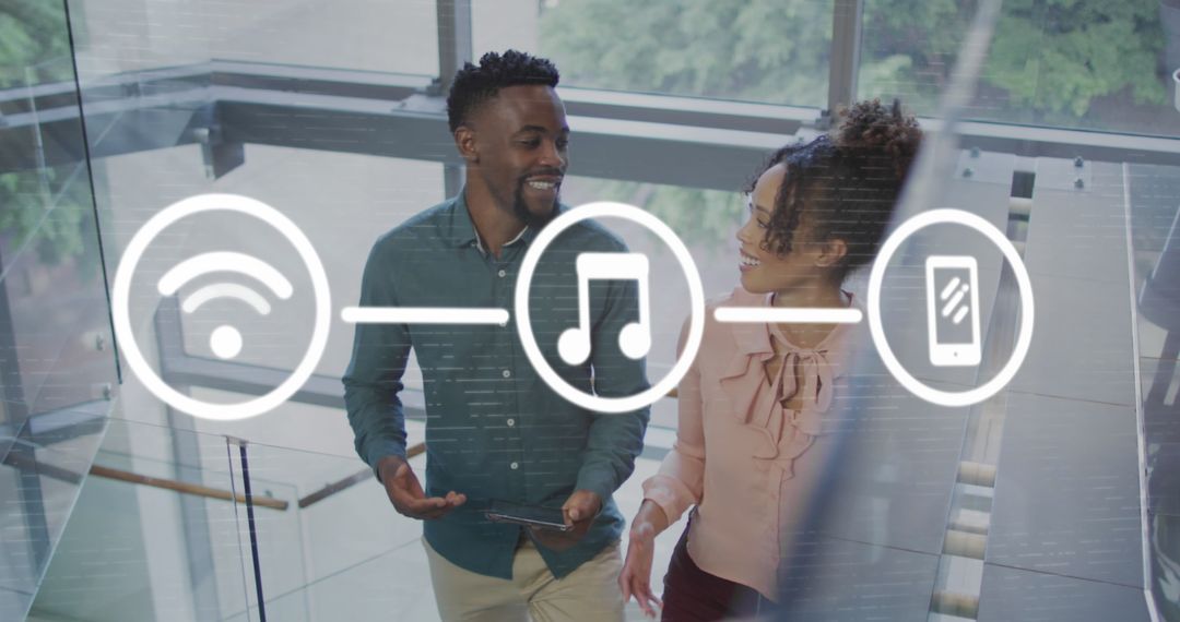 Diverse Professionals Discussing Technology Concepts in Modern Office