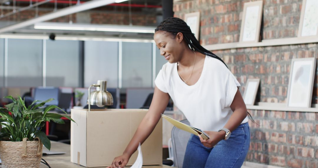 African American Professionals Discussing Project in Modern Office Setting