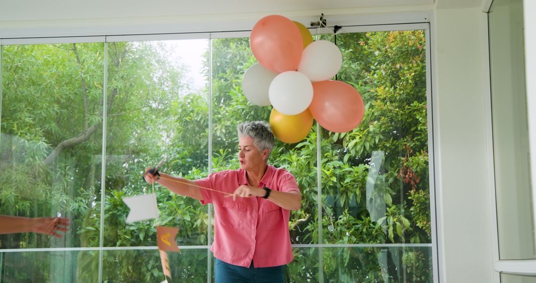 Senior Couple Celebrating with Joyful Clean-Up After Birthday Bash