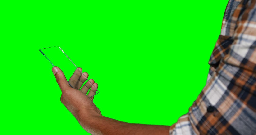 Man Holding Transparent Smartphone Against Green Screen Background - Free Images, Stock Photos and Pictures on Pikwizard.com