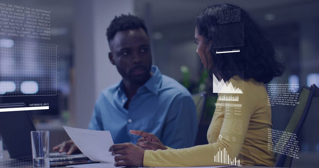 Diverse Colleagues Discussing Data Insights in Modern Office