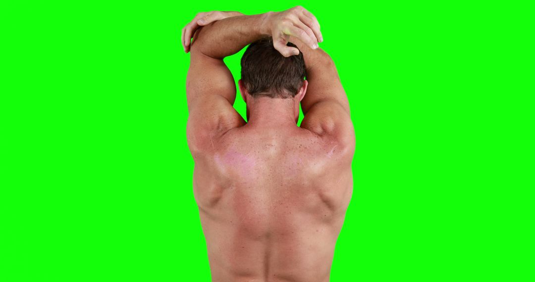 Strong Muscular Man Stretching Arm Back View Green Background - Free Images, Stock Photos and Pictures on Pikwizard.com