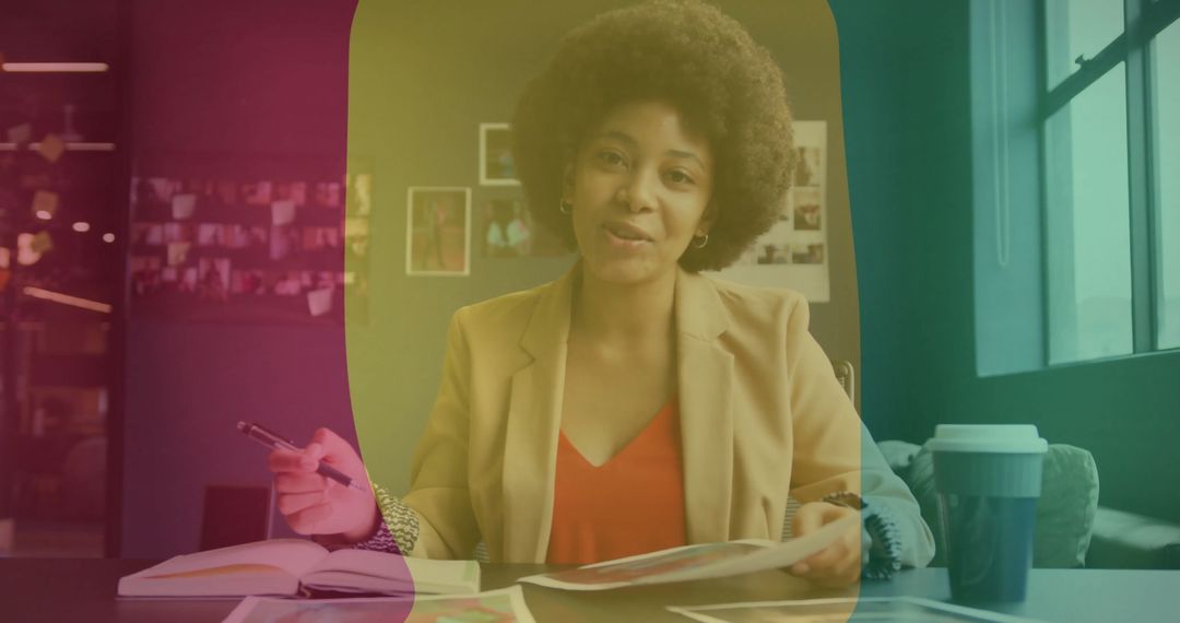 Creative Professional Reviewing Documents in Modern Workspace