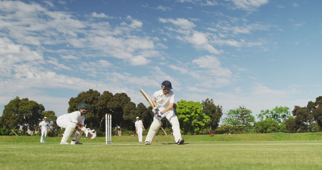 Cricket Batsman Hitting Ball in Sunny Field - Free Images, Stock Photos and Pictures on Pikwizard.com