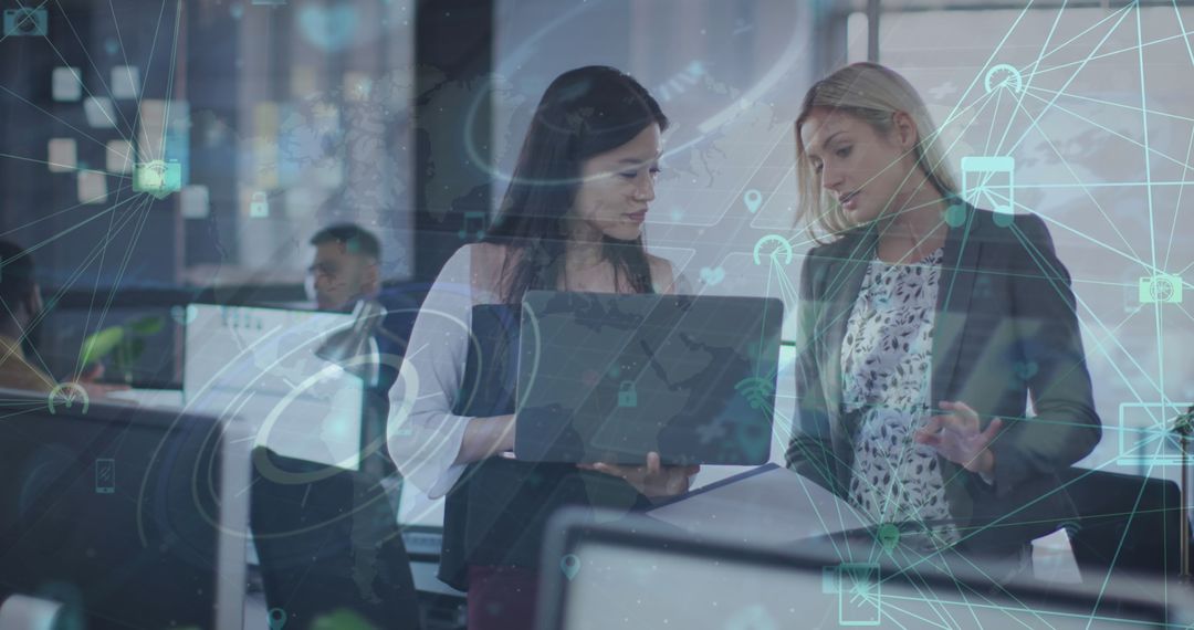 Women Discussing at Office with Digital Interface Graphics