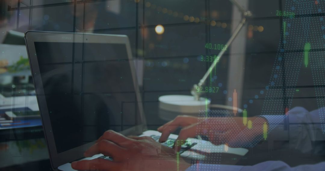 Businessman Analyzing Financial Data on Laptop in Modern Workspace