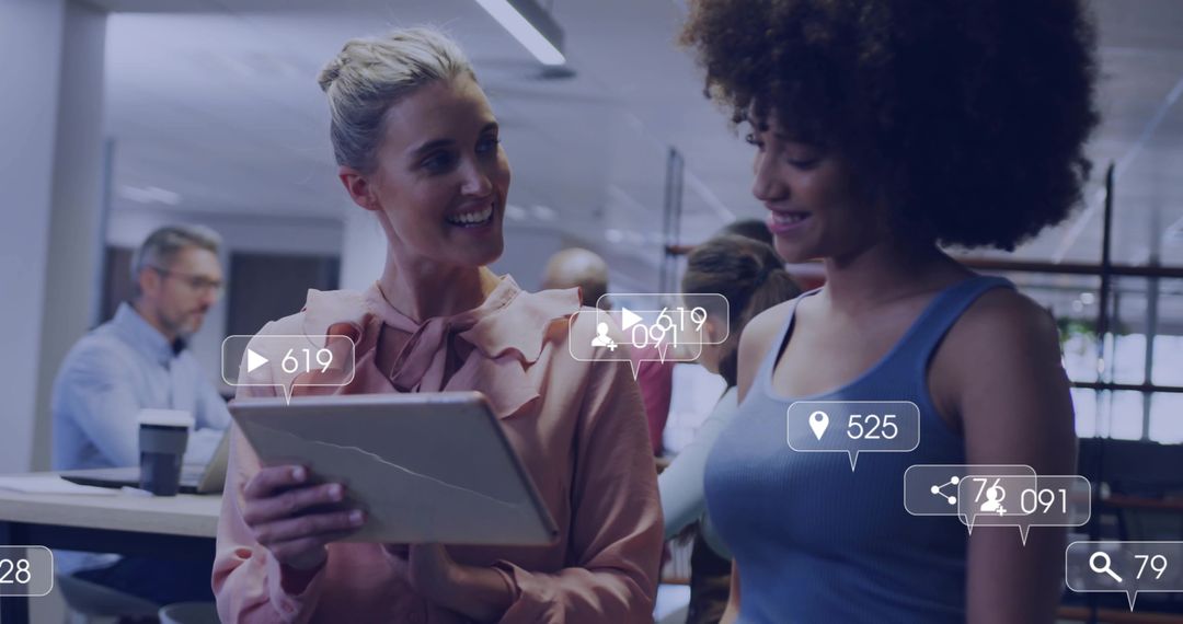 Colleagues collaborating over cracked tablet showing social media overlays and analytics in office