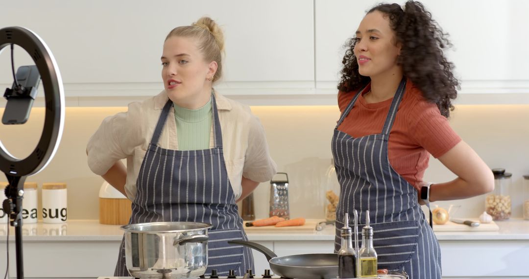 Diverse Female Chefs Hosting Cooking Demo with Ring Light in Modern Kitchen