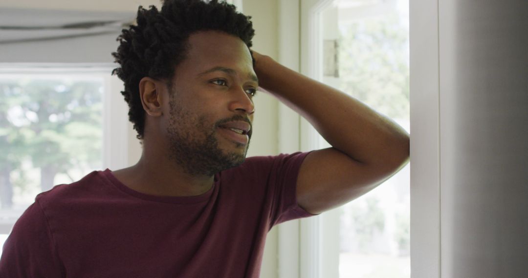 Contemplative Man Relaxing and Enjoying Leisure Time at Home