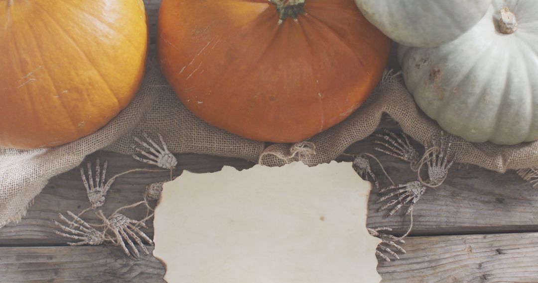 Pumpkins on Rustic Wooden Table with Blank Parchment - Free Images, Stock Photos and Pictures on Pikwizard.com