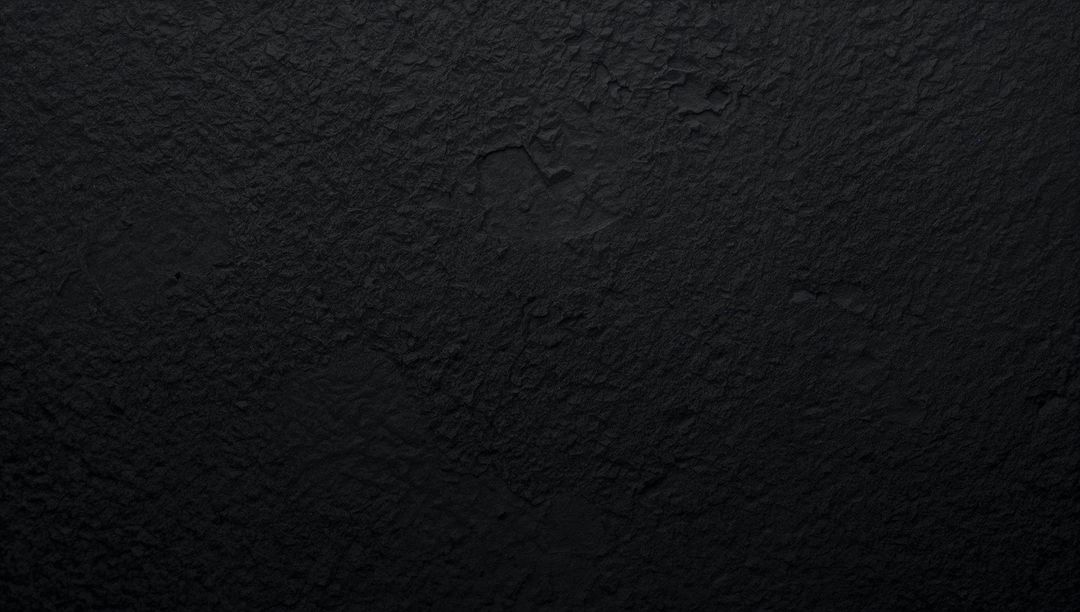 Deep Black Textured Wall Background Featuring Subtle Cracks and Rough Plaster