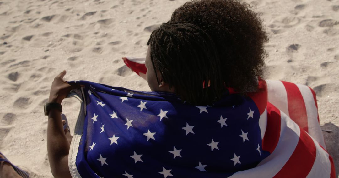 Two Friends Enjoying Beach Wrapped in American Flag - Free Images, Stock Photos and Pictures on Pikwizard.com