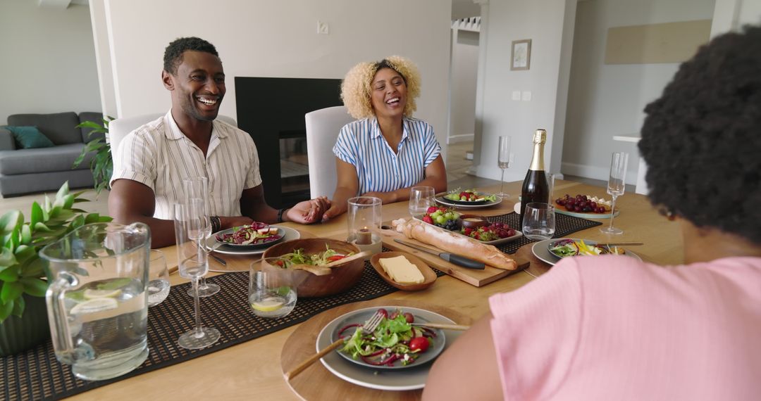 Friends Enjoying Laughter and Lunch at Home Refreshing Ambiance