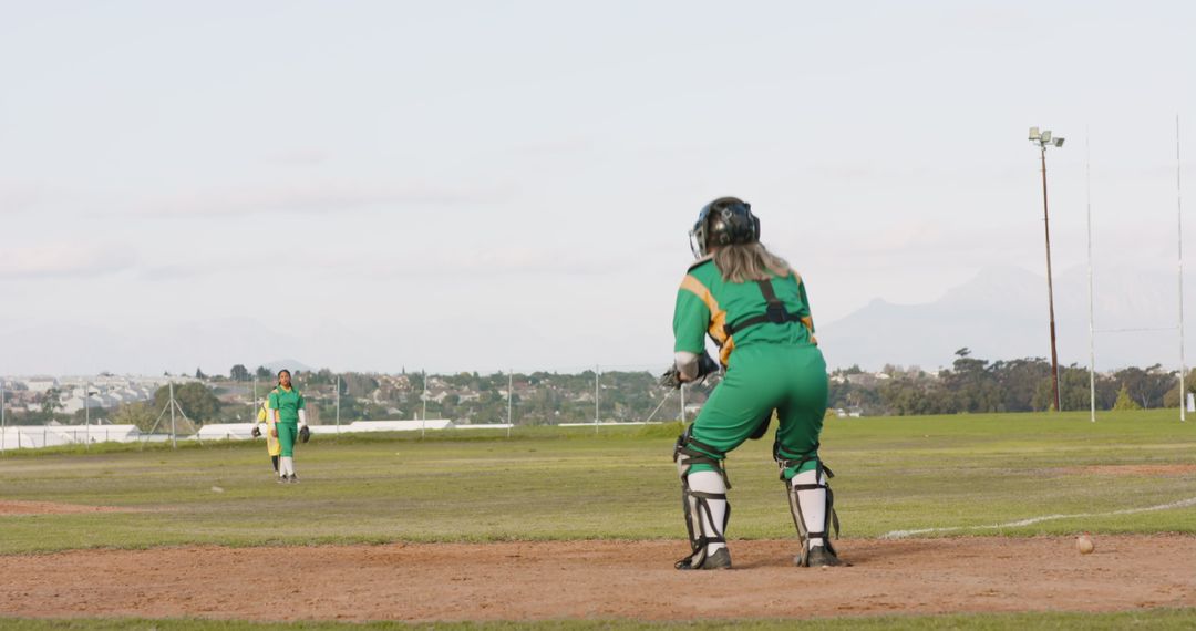 Female Wicketkeeper Ready for Action on Cricket Field
