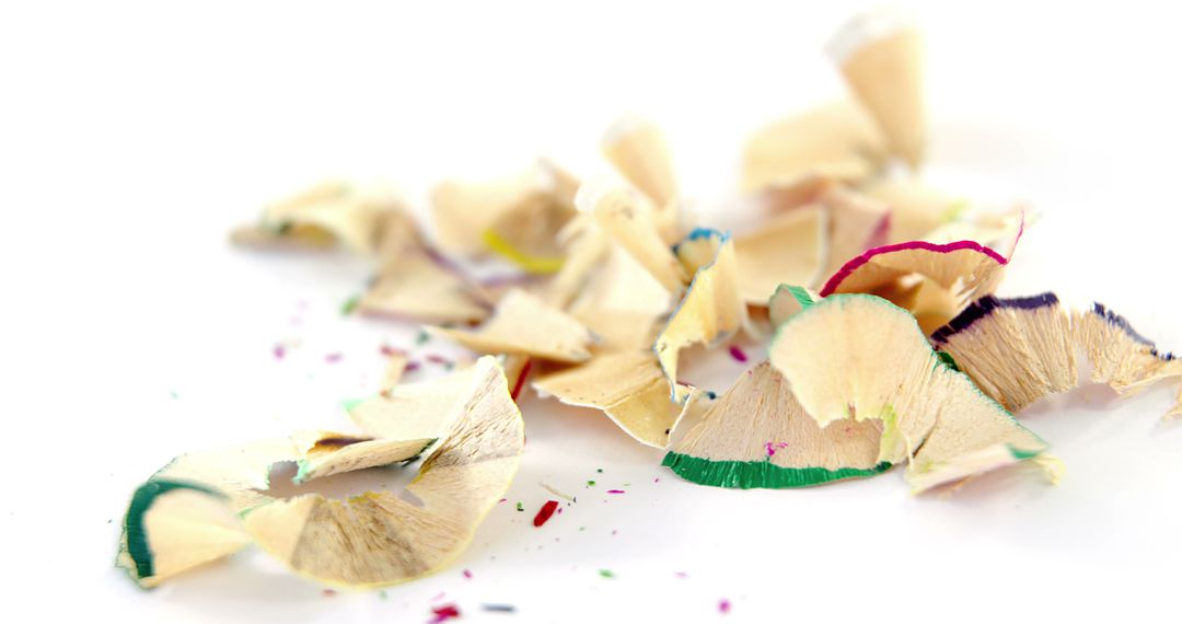 Colorful pencil shavings close-up on white background - Free Images, Stock Photos and Pictures on Pikwizard.com