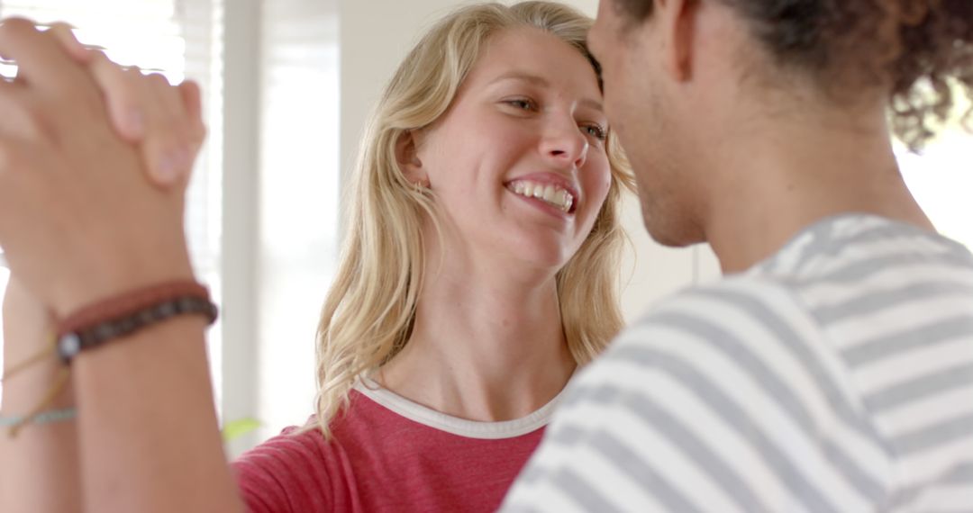 Joyful Diverse Couple Dancing at Home in Relaxed Atmosphere