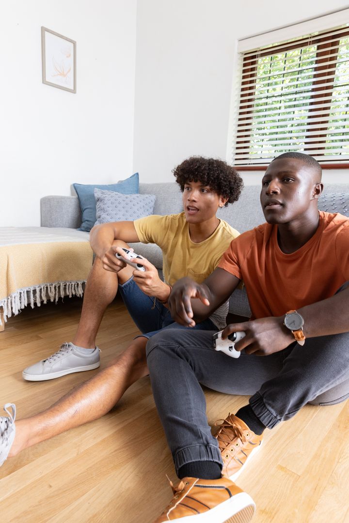 Diverse Friends Enjoying Video Game on Relaxed Weekend