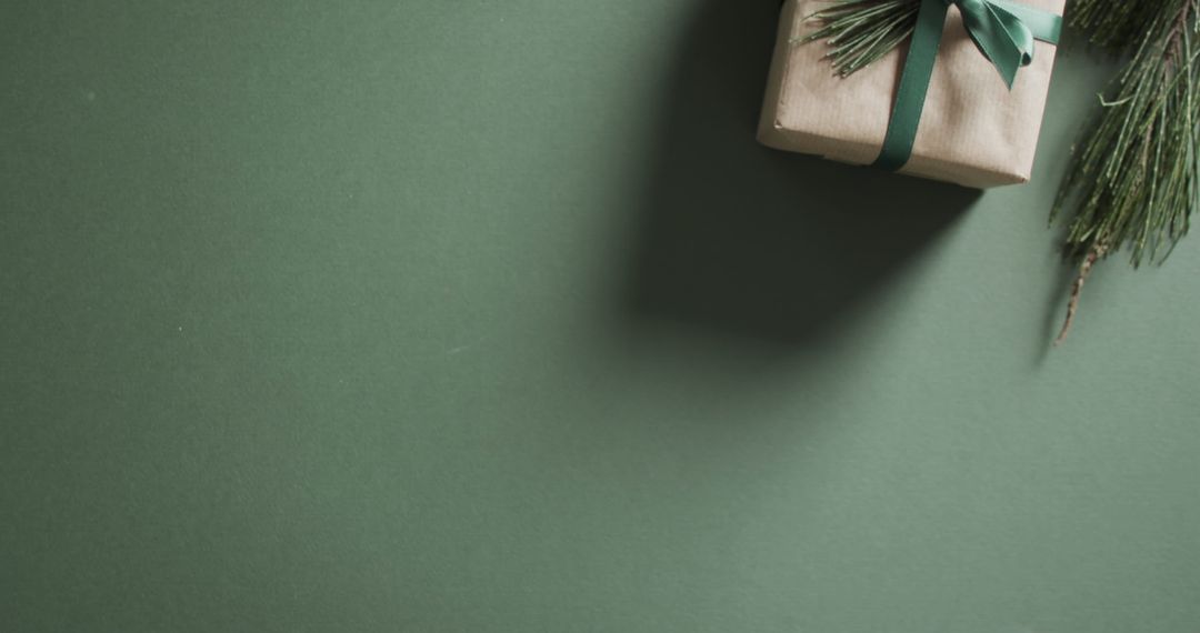 Minimalist Gift Box on Green Background with Copy Space