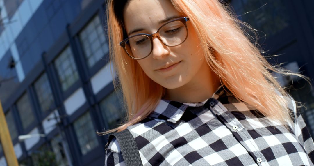 Young Woman with Pink Hair and Glasses Smiling Outdoors - Free Images, Stock Photos and Pictures on Pikwizard.com