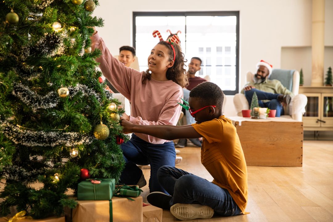 Children Decorating Christmas Tree with Underlying Joy and Togetherness