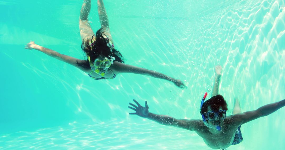 Couple Enjoying Snorkeling in Swimming Pool on Tropical Vacation - Free Images, Stock Photos and Pictures on Pikwizard.com