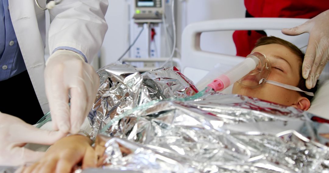 Healthcare Professionals Attending to Patient in Hospital Bed with Oxygen Mask - Free Images, Stock Photos and Pictures on Pikwizard.com