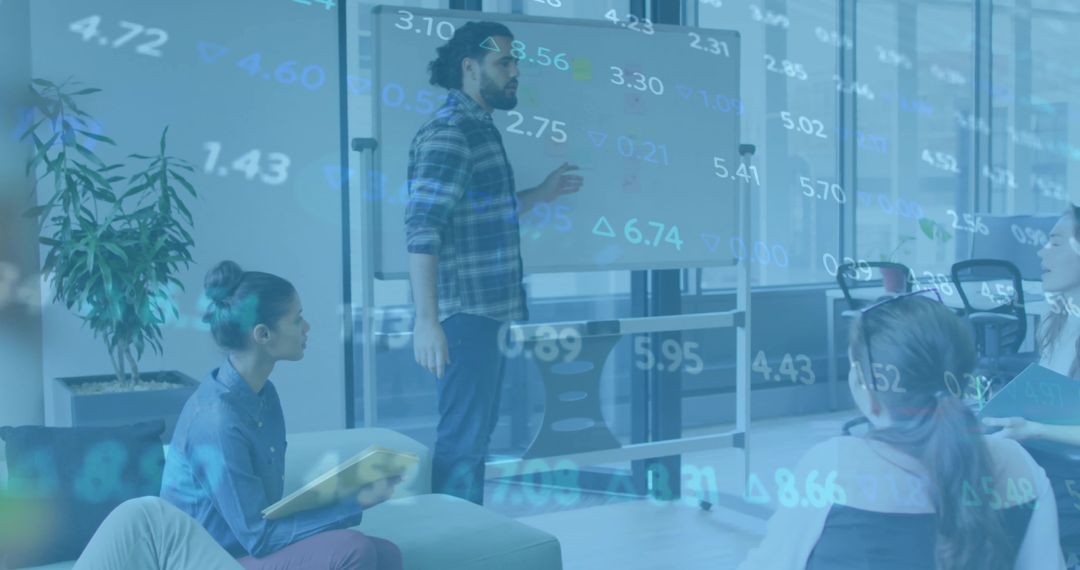 Collaborative Team Analyzing Data in Modern Office Lounge