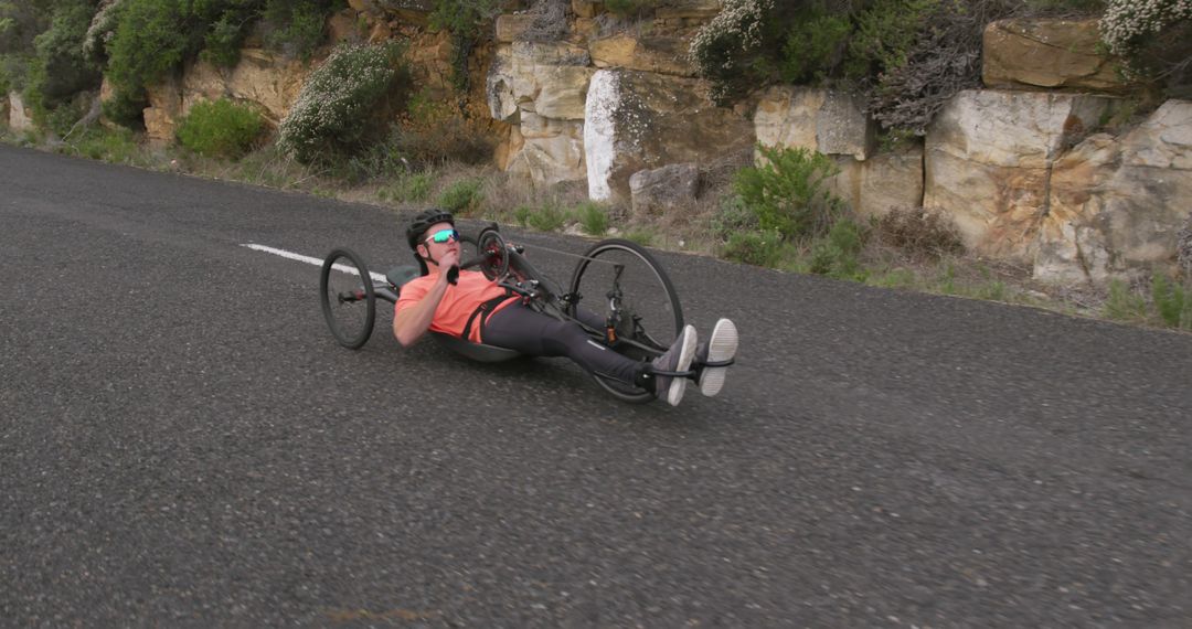 Athlete Training in Handcycle on Open Road - Free Images, Stock Photos and Pictures on Pikwizard.com