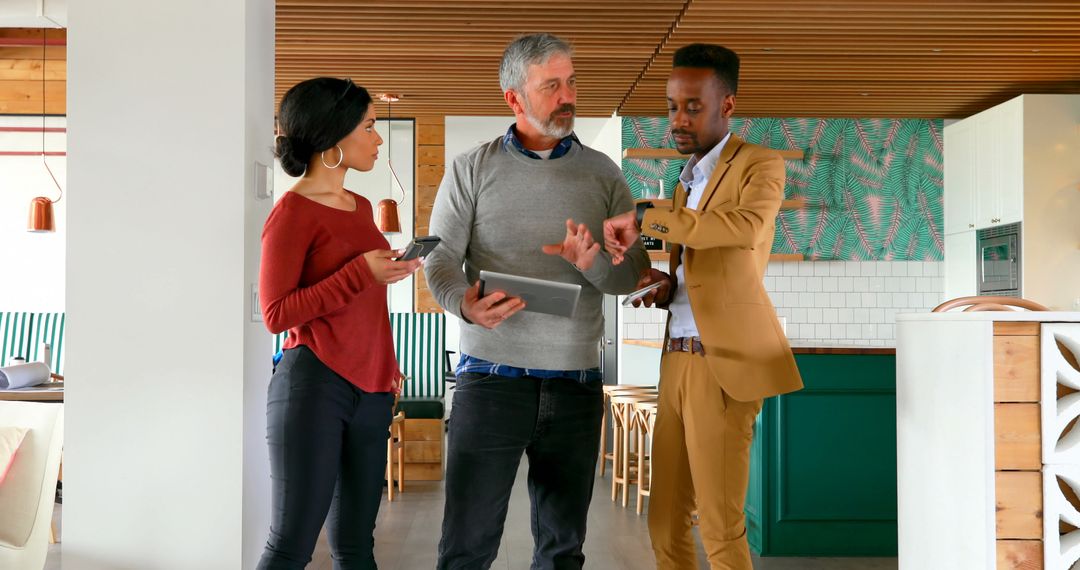 Diverse Team Collaborating with Tablet in Modern Office Space