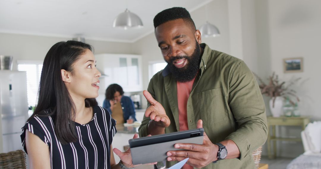 Diverse Team Collaborating at Home Using Tablet