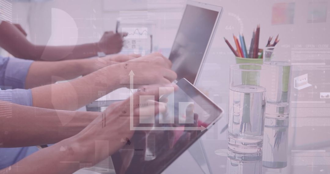 Business Team Analyzing Data on Digital Devices with Graph Overlay