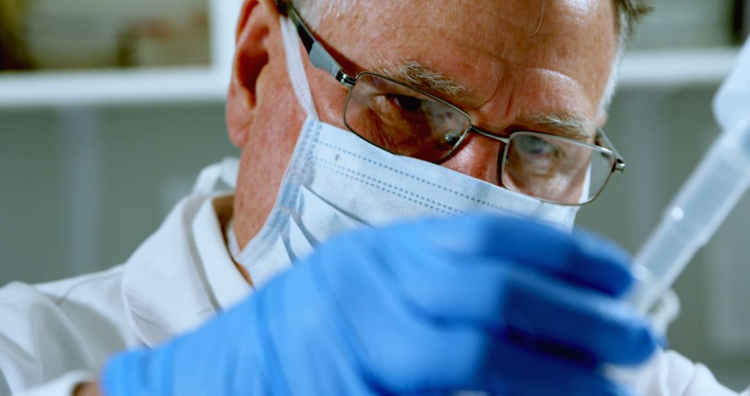 Senior Scientist Conducting Experiment in Laboratory with Test Tube - Free Images, Stock Photos and Pictures on Pikwizard.com