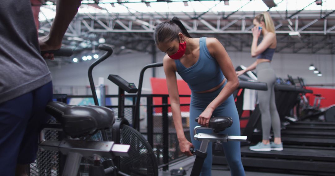 Women Working Out At Gym Wearing Face Masks During Pandemic - Free Images, Stock Photos and Pictures on Pikwizard.com