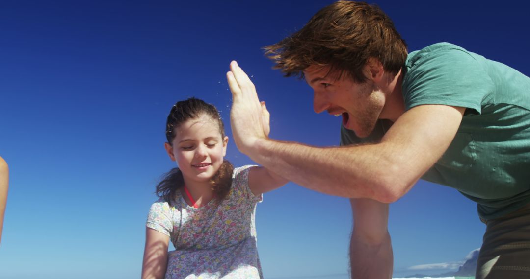 Father and Daughter Sharing Joyful Moment Outdoors - Free Images, Stock Photos and Pictures on Pikwizard.com