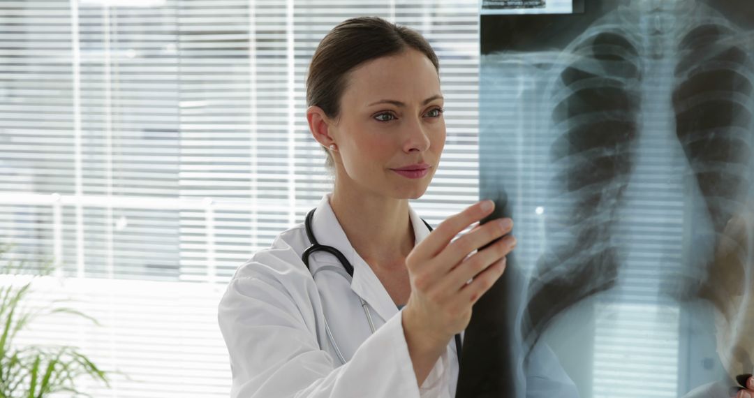 Female Doctor Analyzing Chest X-Ray - Free Images, Stock Photos and Pictures on Pikwizard.com