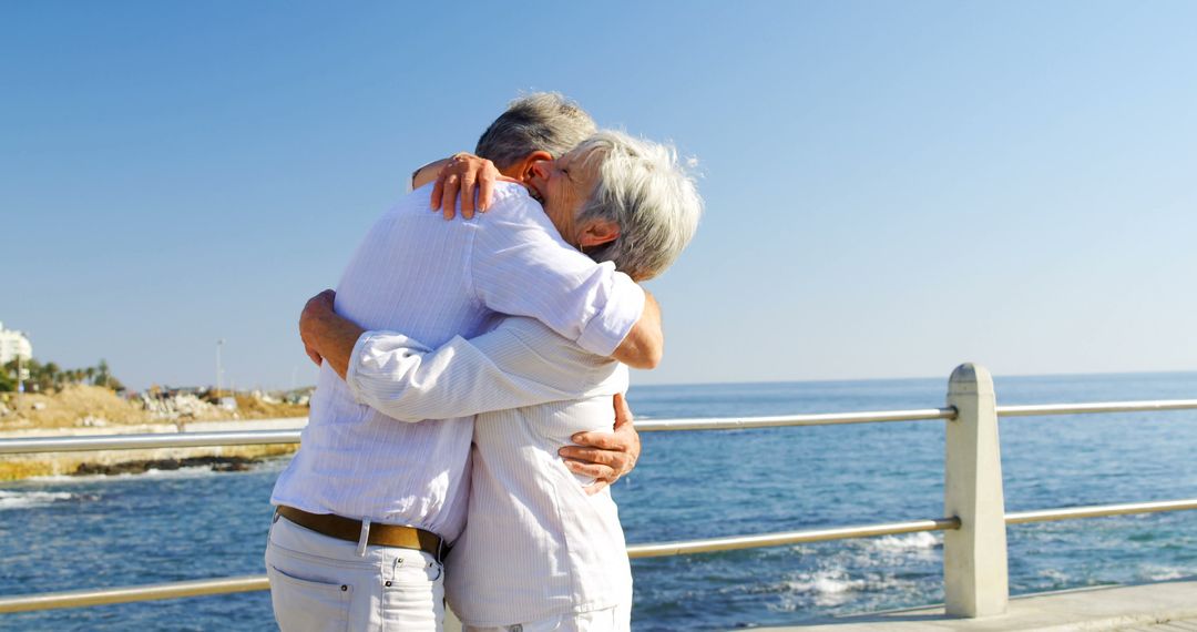 Senior Couple Embracing by the Sea - Free Images, Stock Photos and Pictures on Pikwizard.com